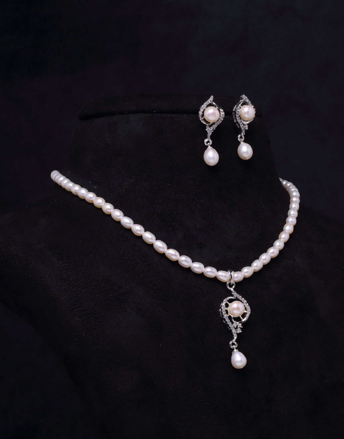 Oval Beaded Pearl Set with Stone Studded Charms And Drop Dangled Pearls