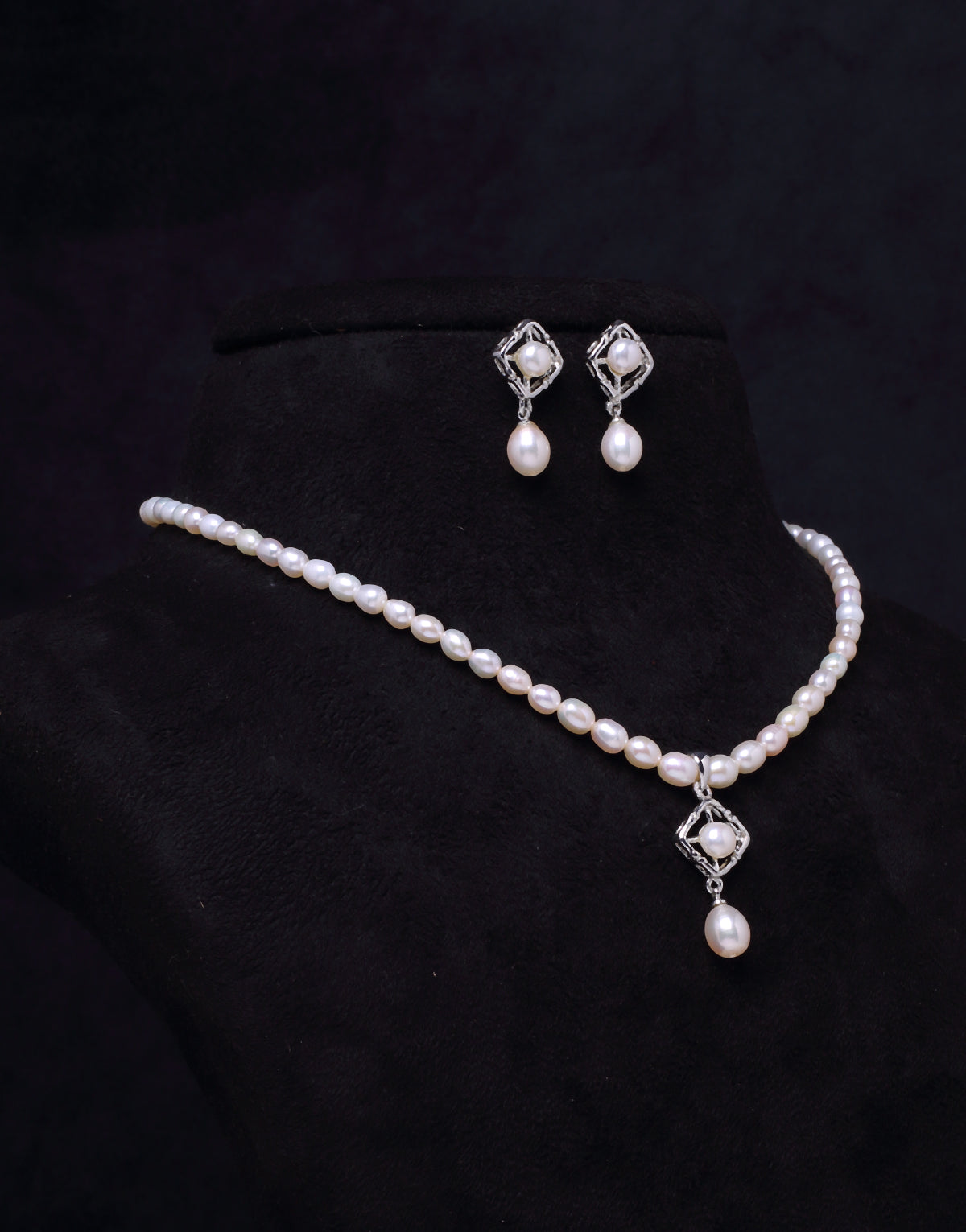 Pearl Studded Charms Tangled in Beaded Oval Pearl Set