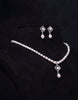 Pearl Studded Charms Tangled in Beaded Oval Pearl Set