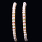Beautiful white pearl bangles beaded with luxurious Ruby and Emerald