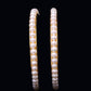 Round single incomparable white pearls bangles embellished with  Gold alloy Base