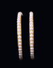 Round single incomparable white pearls bangles embellished with  Gold alloy Base