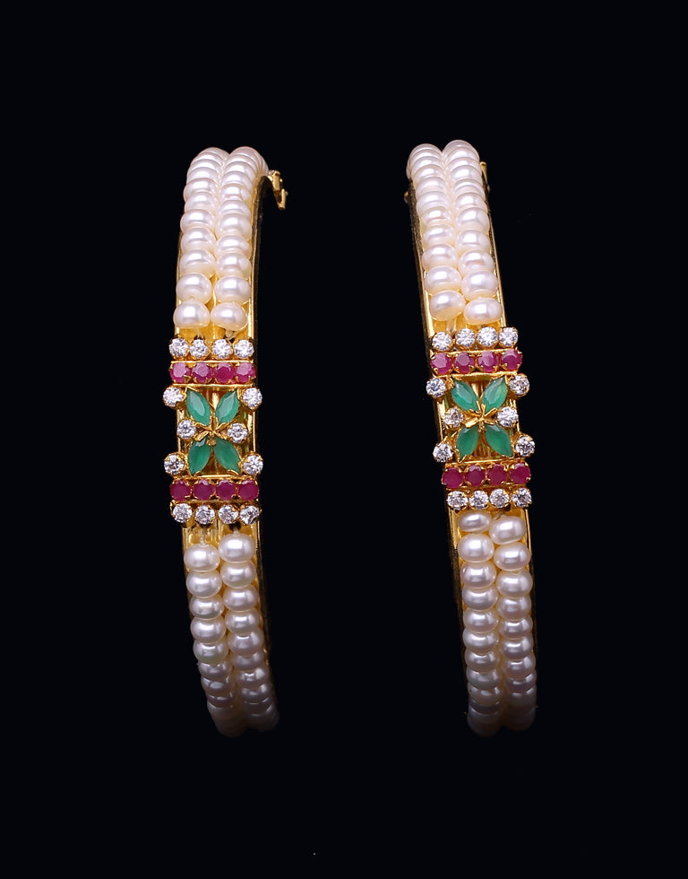 Two Line White Freshwater Pearl Bangles Studded With Semi Precious Stones